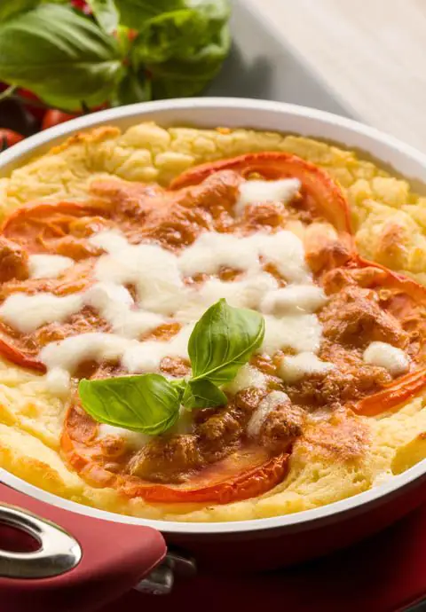 Polenta com refogado de espinafres e tomatinhos tostados